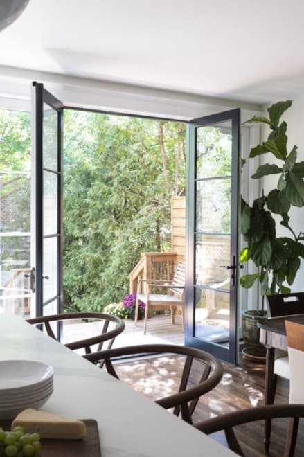 Floor-to-ceiling doors leading to new deck